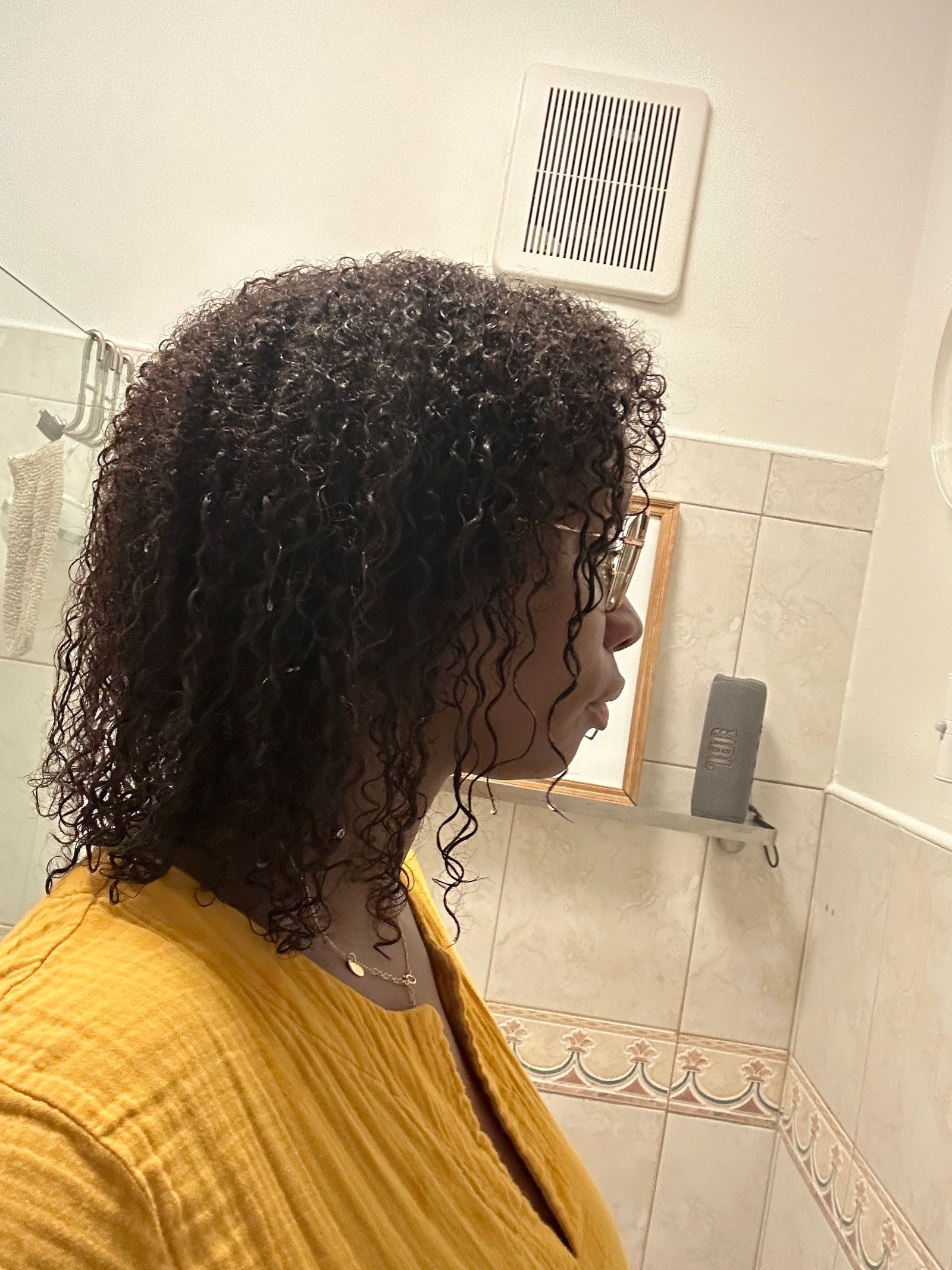 Image may contain Hair Person Curly Hair Adult Head and Face