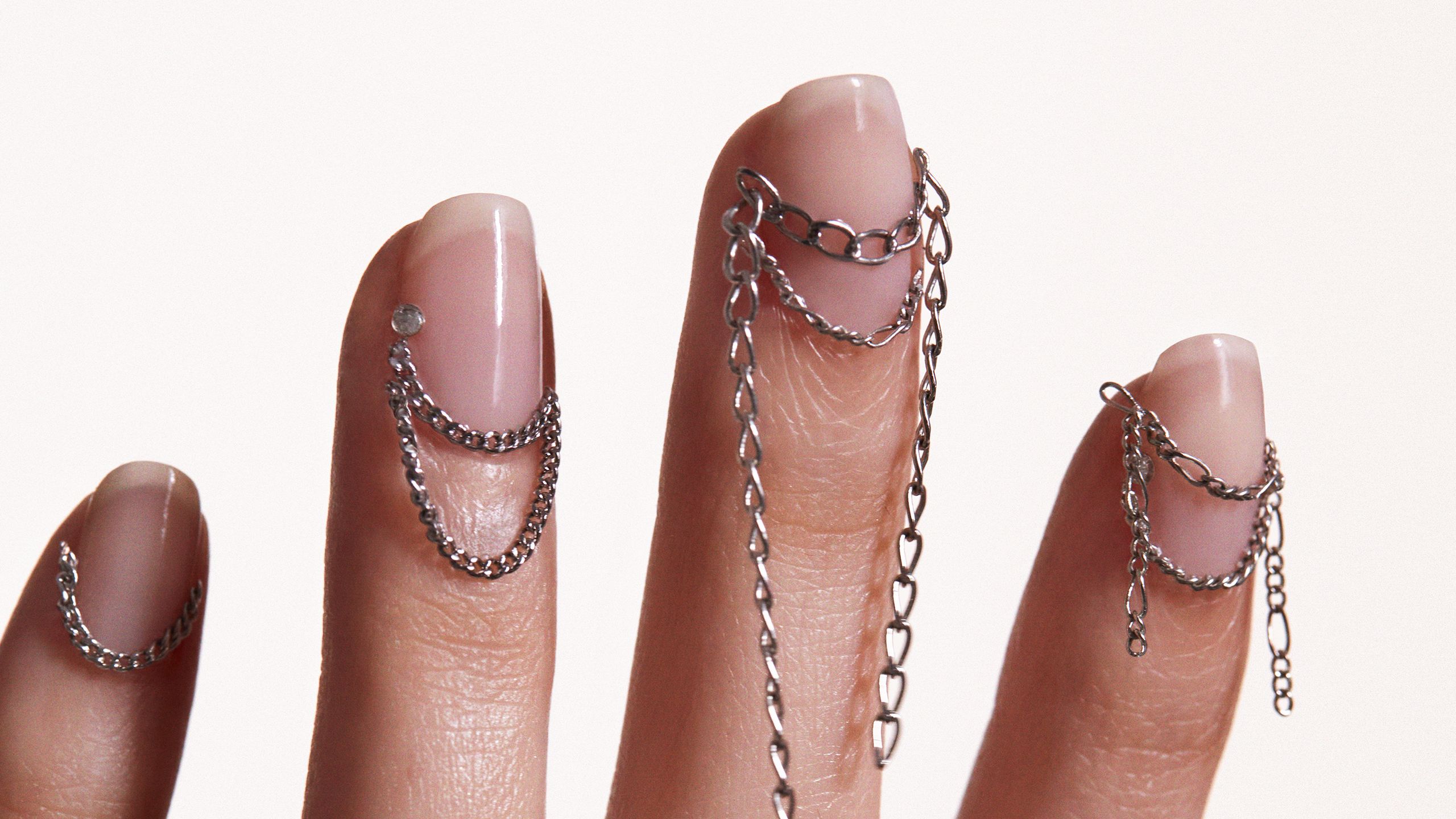 Image may contain Body Part Finger Hand Person Nail Adult Accessories Jewelry and Necklace