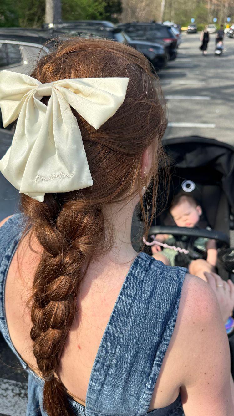 Image may contain Hair Person Adult Car Transportation Vehicle and Braid