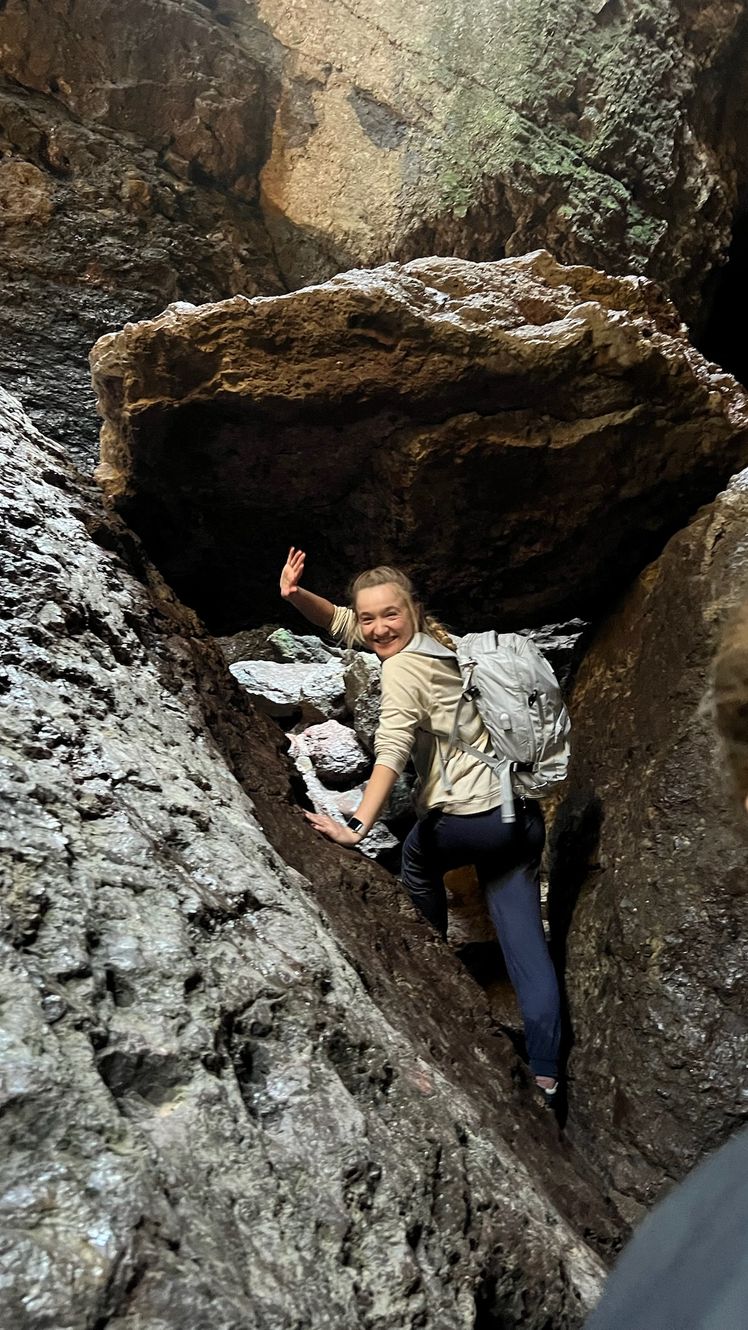 Image may contain Rock Face Head Person Photography Portrait Adult Backpack Bag Outdoors Adventure and Hiking