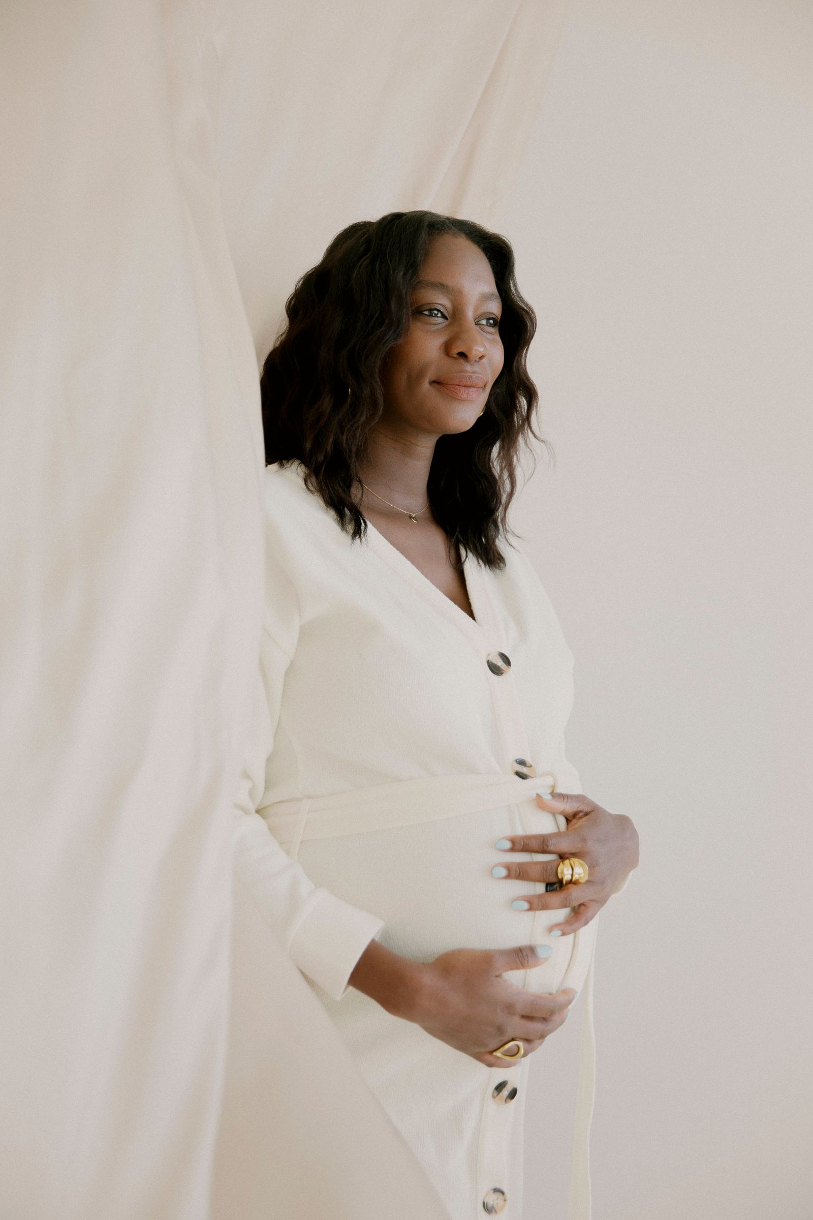 Pregnancy portrait against fabric