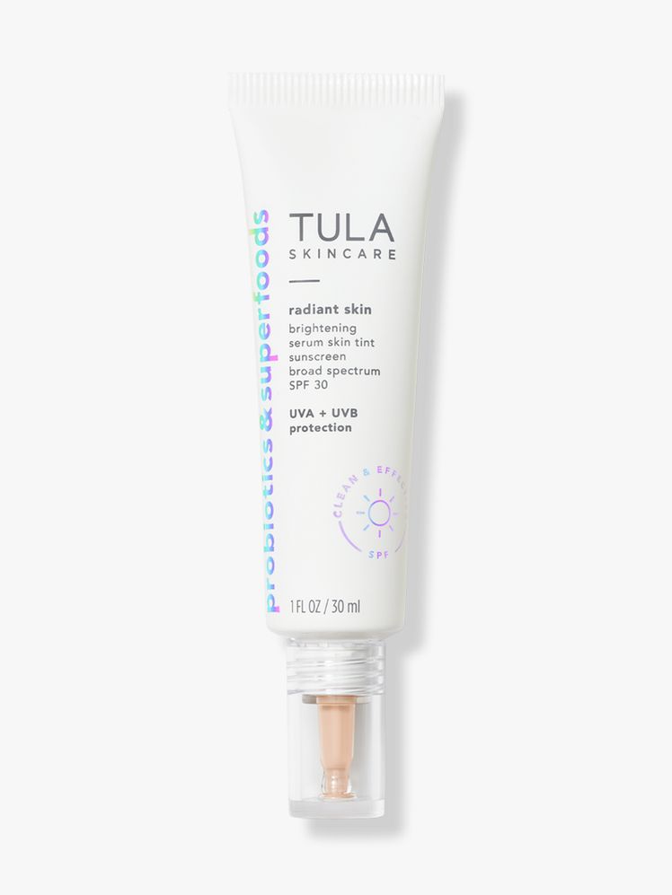 Tula Radiant Skin Brightening Serum Skin Tint SPF 30 white tube on light gray background