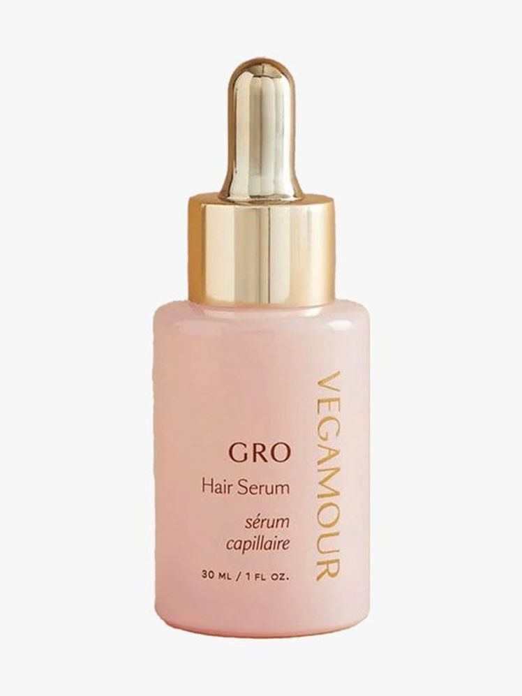 Vegamour GRO Hair Serum pink and gold serum dropper bottle on light gray background