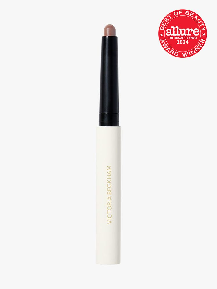 Victoria Beckham Contour Stylus Precision Contour Stick branded component in white and black on a light gray background...