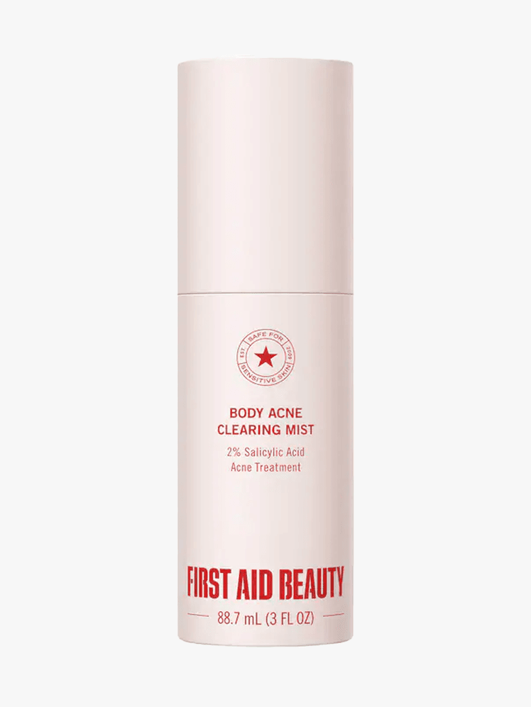 First Aid Beauty Body Acne Clearing Mist in branded component on a light gray background