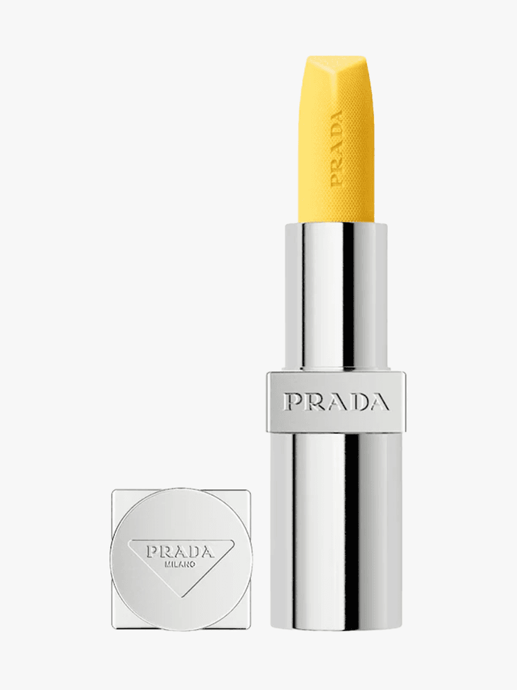 Prada Hydrating Lip Balm with Jojoba Oil in branded component on a light gray background