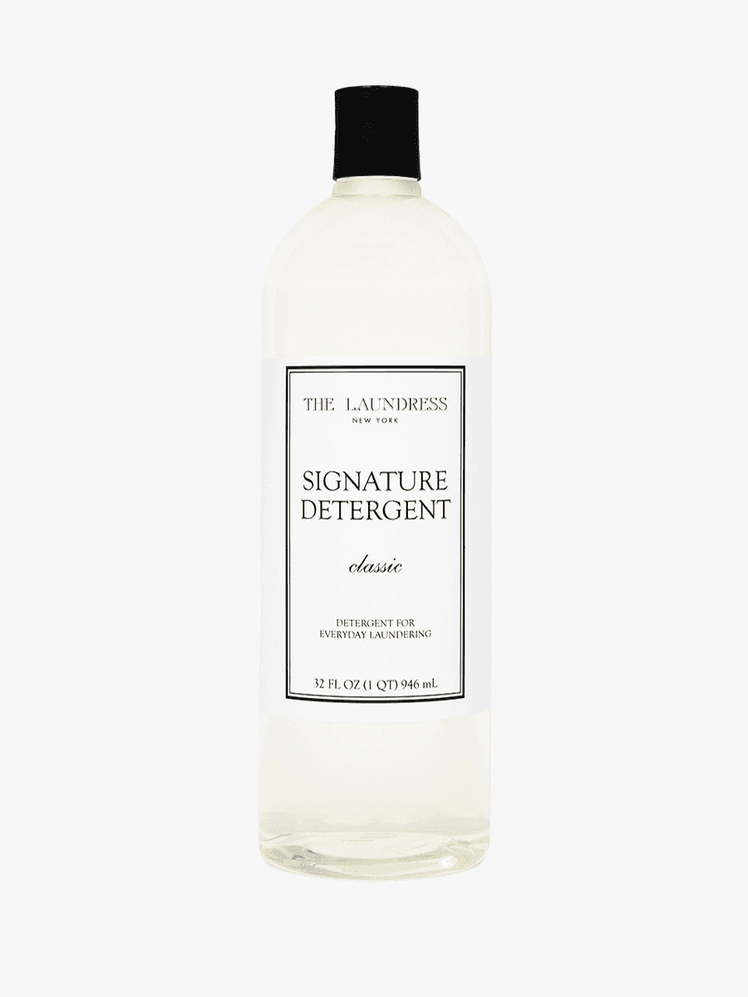 The Laundress Signature Detergent bottle on a grey background
